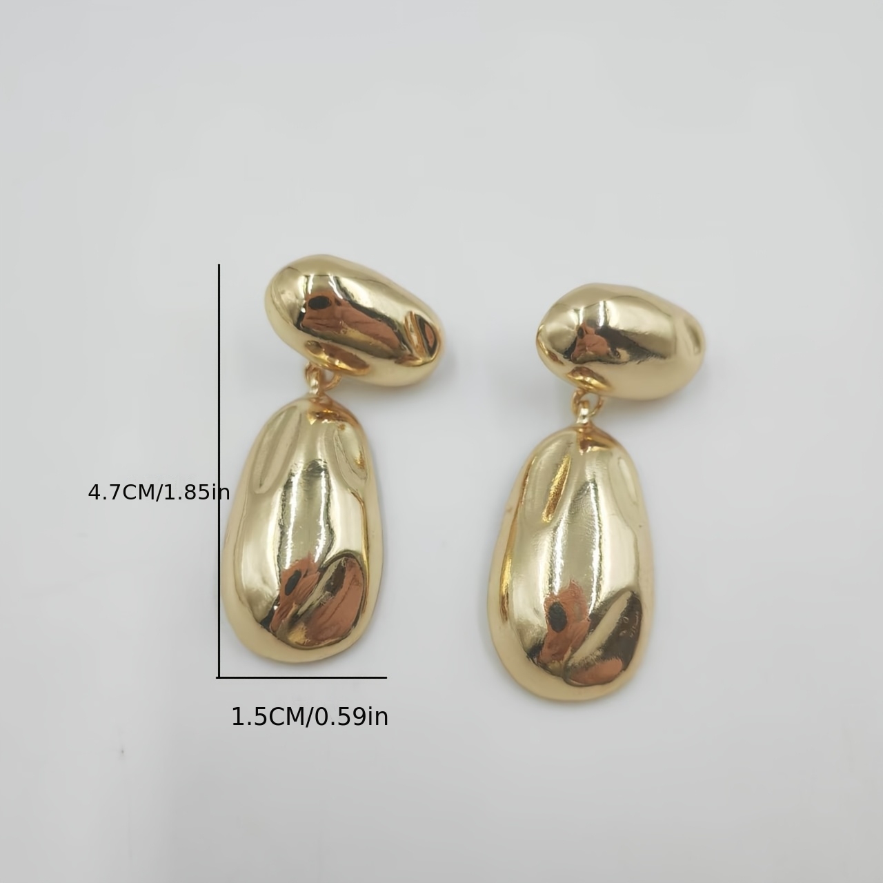 Metal Earrings with Golden Glossy Finish and Teardrop Pendant